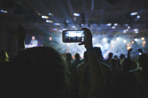 taking a picture at a concert with a cellphone 