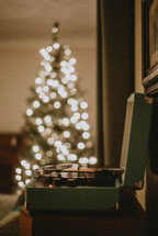 bokeh Christmas tree and vintage record player