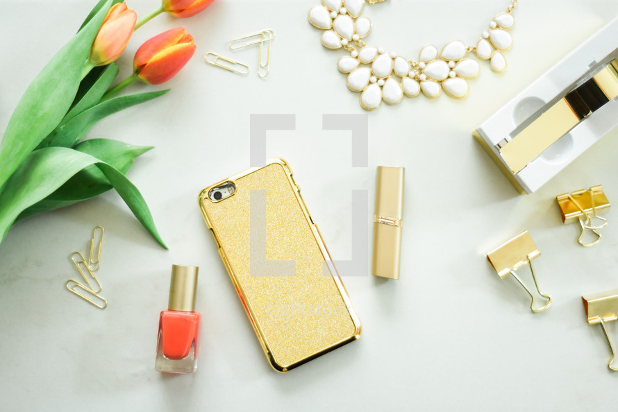 tulips, gold, paperclips, necklace, tape, white background, iPhone, nail polish, tape dispenser 