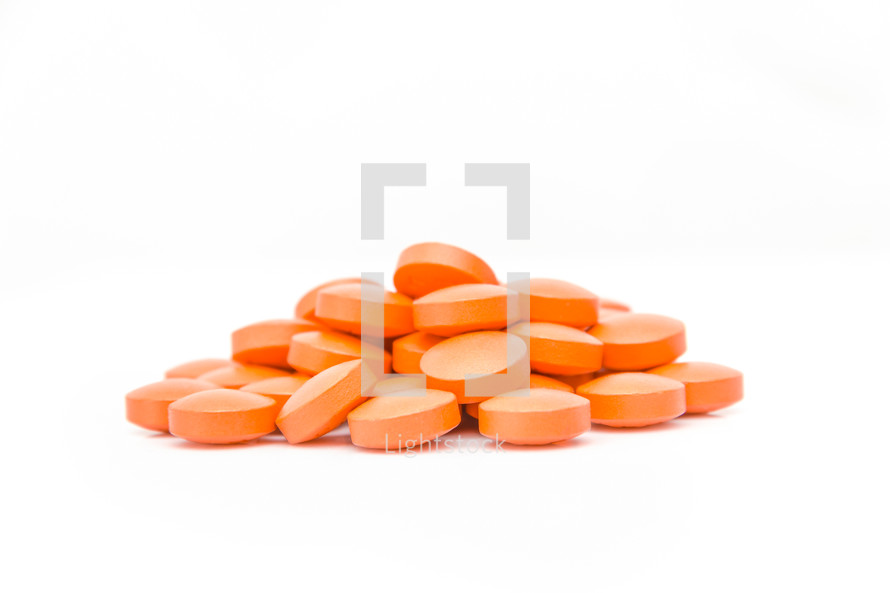 Pills against a white background. 