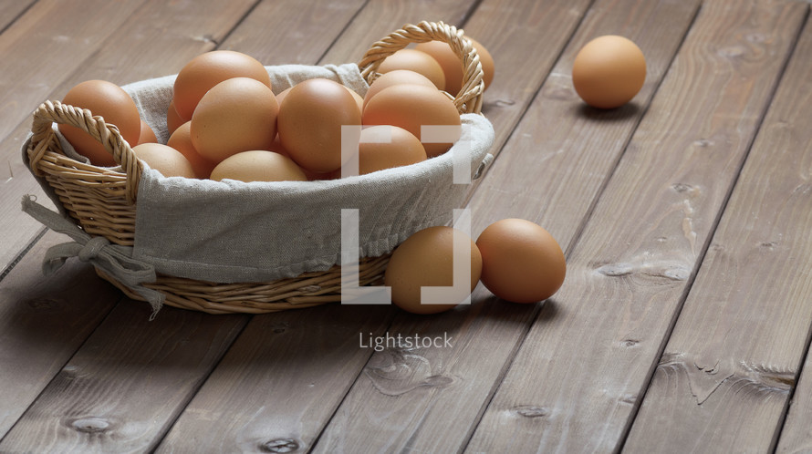  brown eggs in a basket 