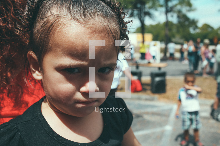 A frowning little girl.