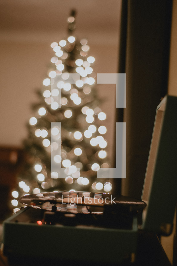 bokeh Christmas tree and vintage record player