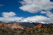 red rock peaks and snow capped mountains 