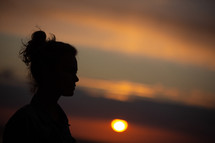 silhouette of a woman at sunset 