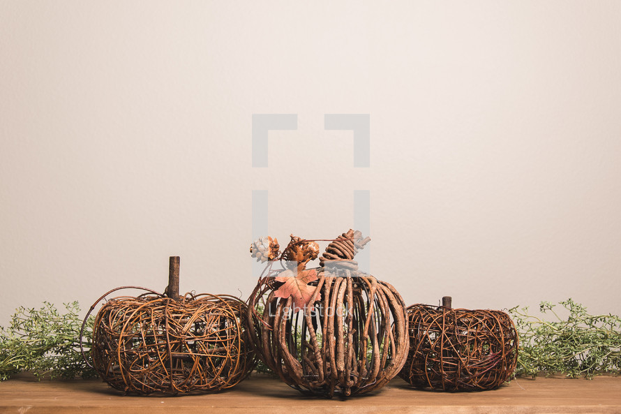 wooden pumpkin and greenery 