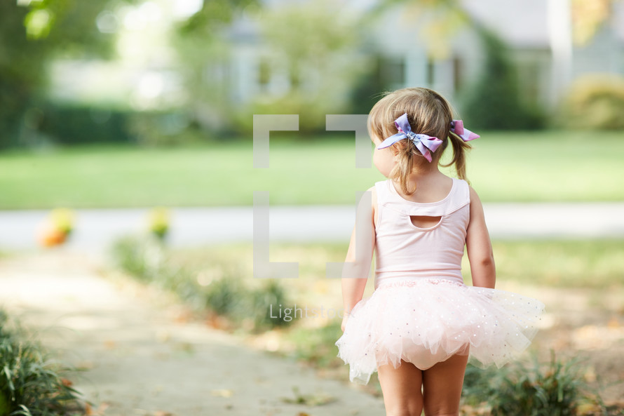 a girl child in a tutu on Halloween 