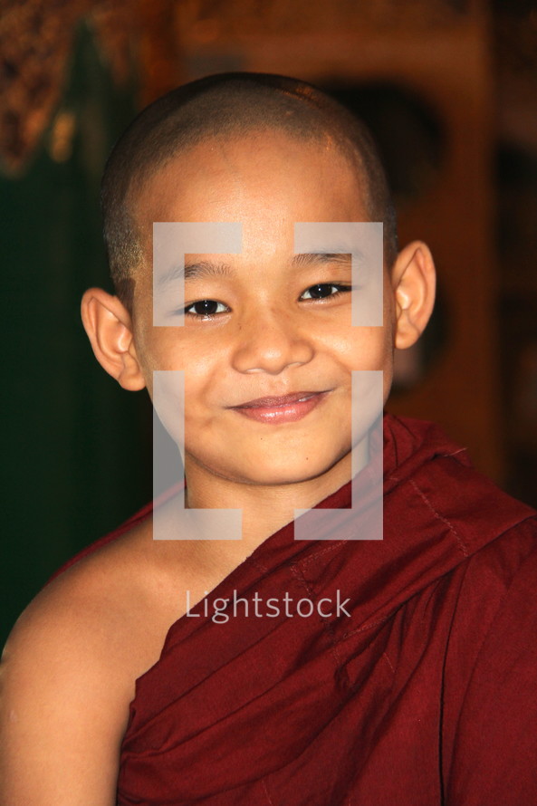 Smiling face of a novice monk