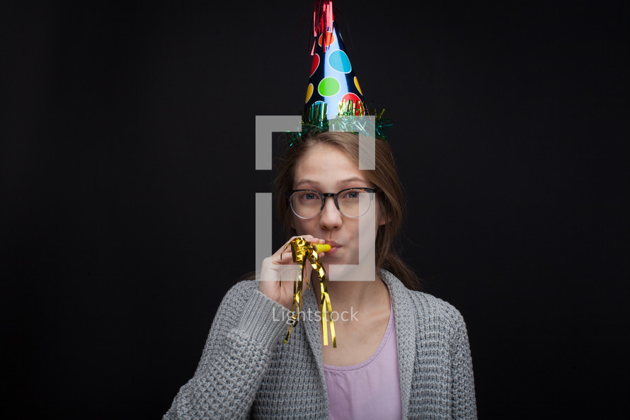 A woman wearing a party hat 