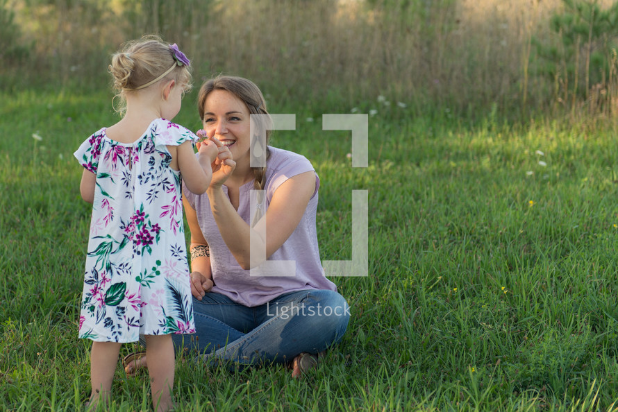 mother and daughter picking flowers 