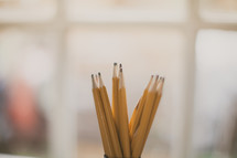 sharpened pencils in a cup 