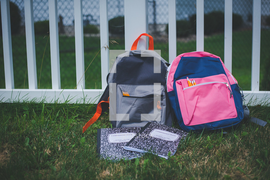 book bags in the grass