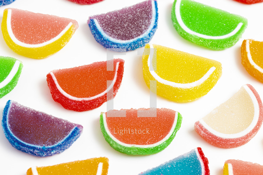 A Variety of Multicolored Candy Fruit Slice Isolated on a White Background