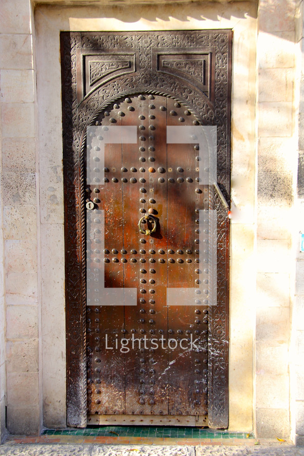 Studded ancient wooden door
