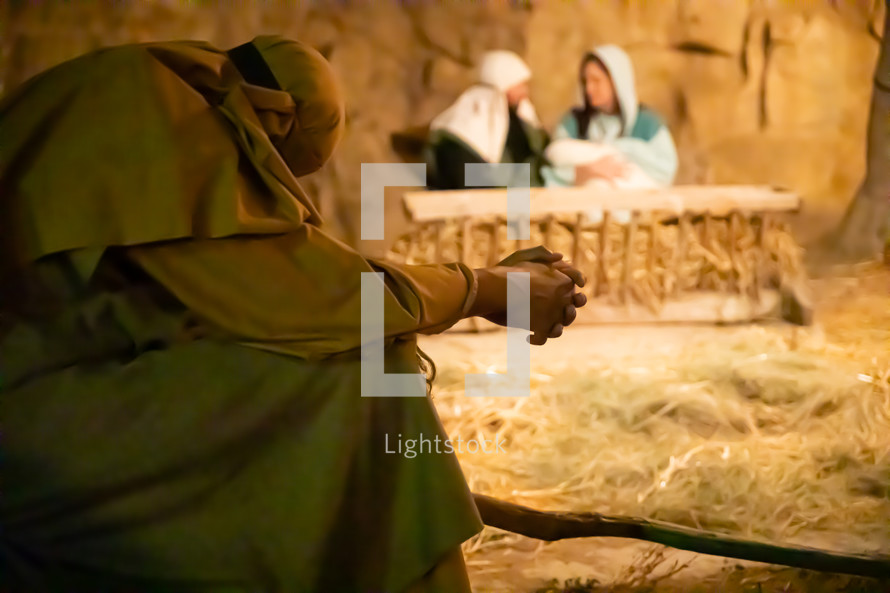 shepherd praying by the manger 