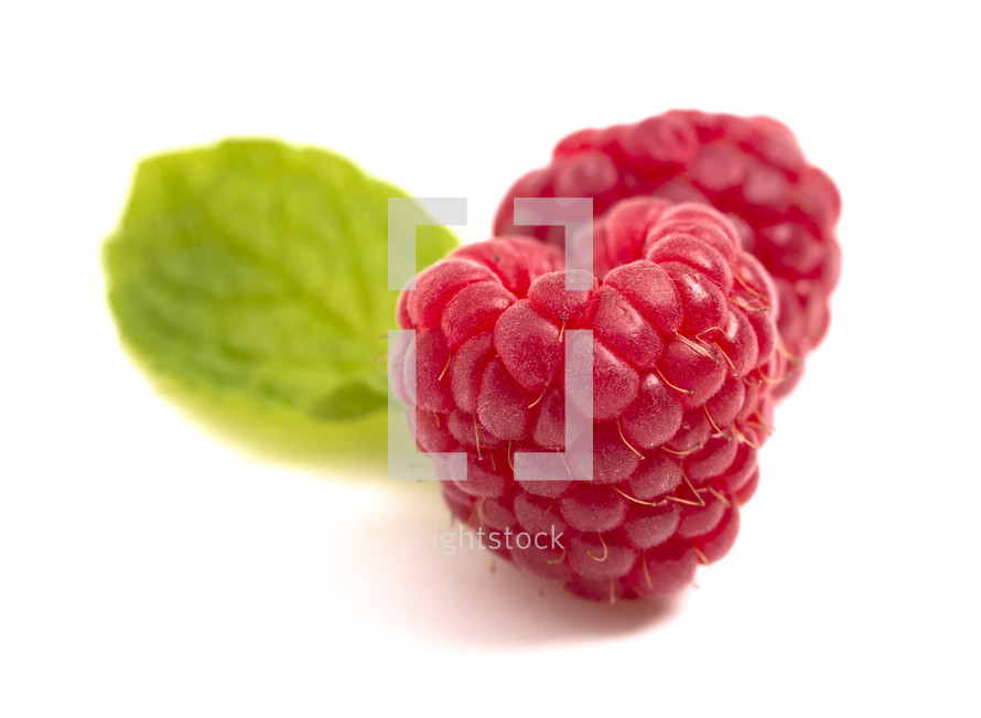 heart shaped Raspberries Isolated on a White Background