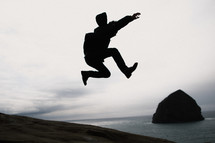 silhouette of a man leaping 