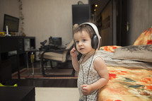 toddler listening to headphones 