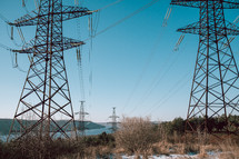 High voltage substation.World electricity crisis.Steel power transmission pylons