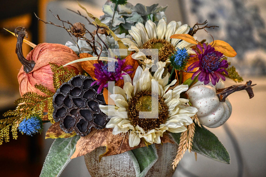 fall flower arrangement with pumpkins and sunflowers 