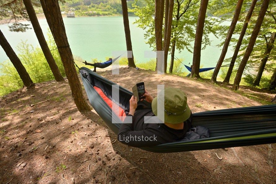 relaxing in a hammock in a forest 