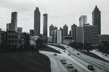 City skyline and freeway traffic.