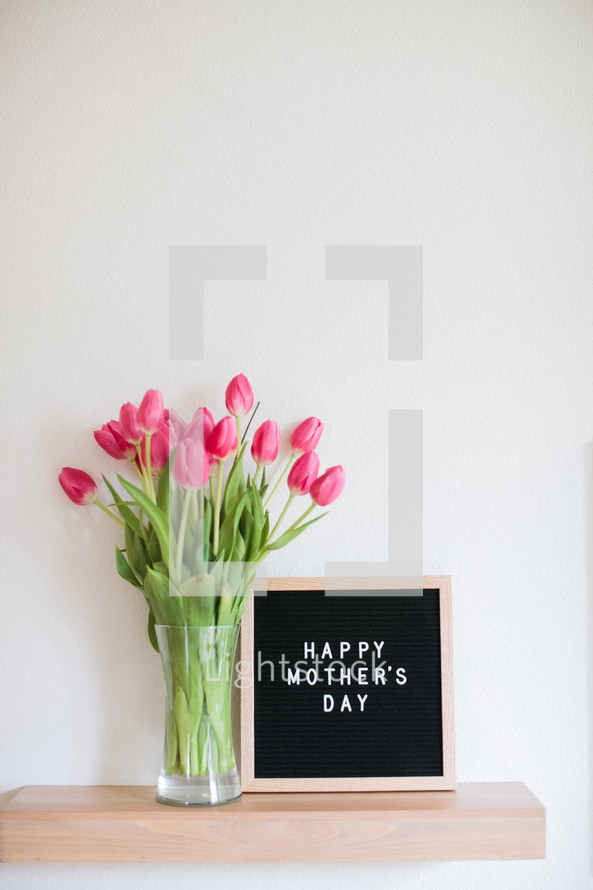 tulips in a vase and a Happy Mother's day sign