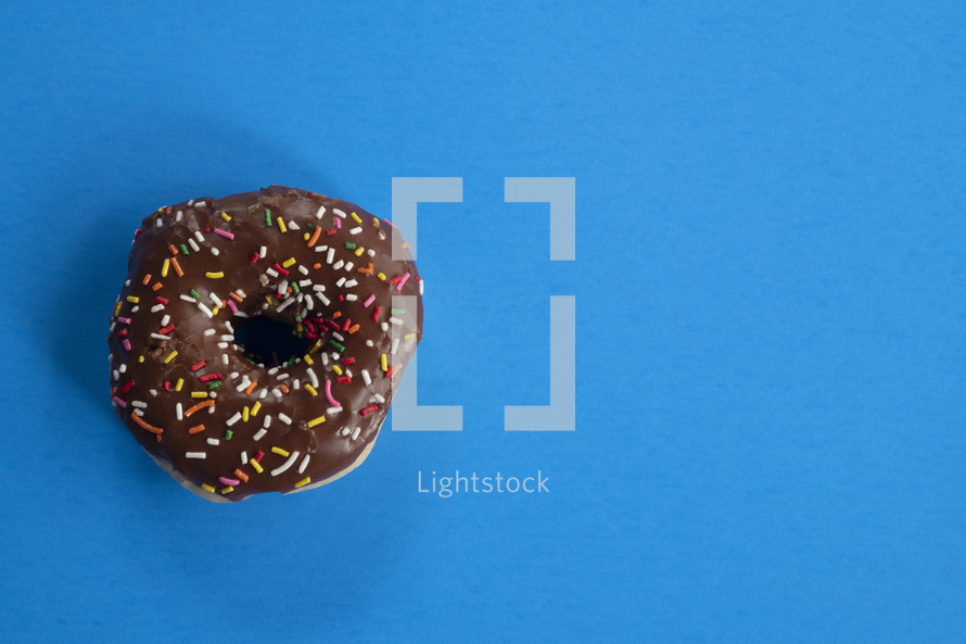 sprinkled donut on a blue background 