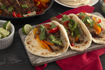 Beef Fajitas with Bell Peppers on a  Wood Table