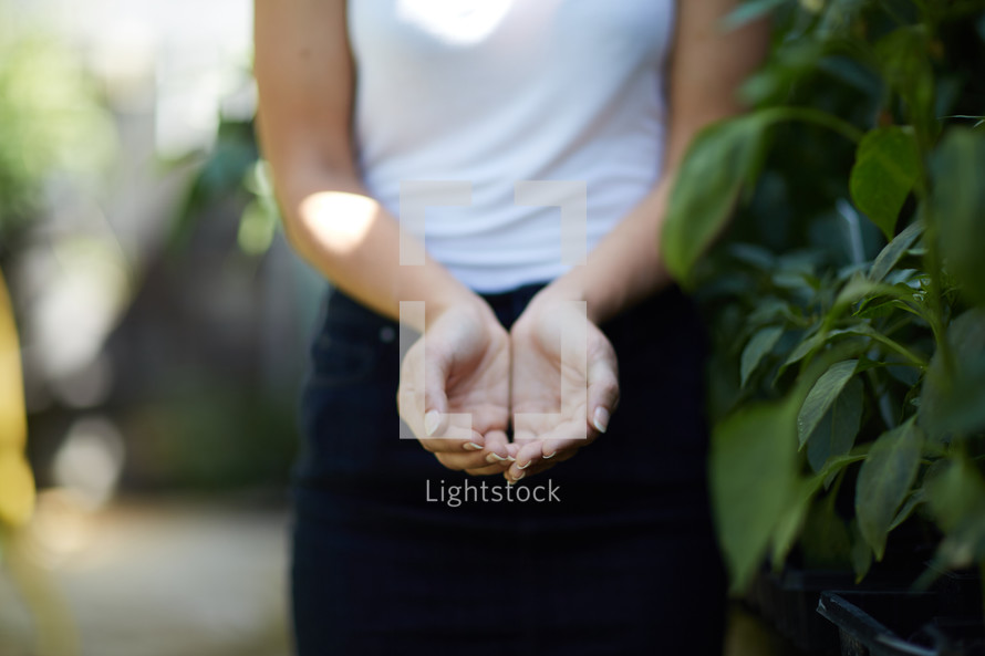a woman with cupped hands 