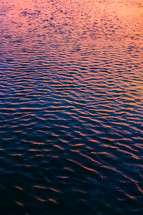 ripples on water at sunset 