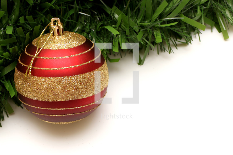 red and gold ornament and garland 
