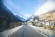 a road leading to a mountain village 