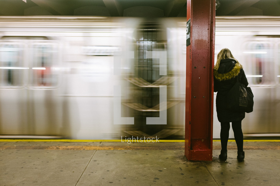 woman waiting in a subway 