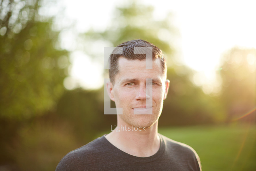 headshot of a man standing outdoors 