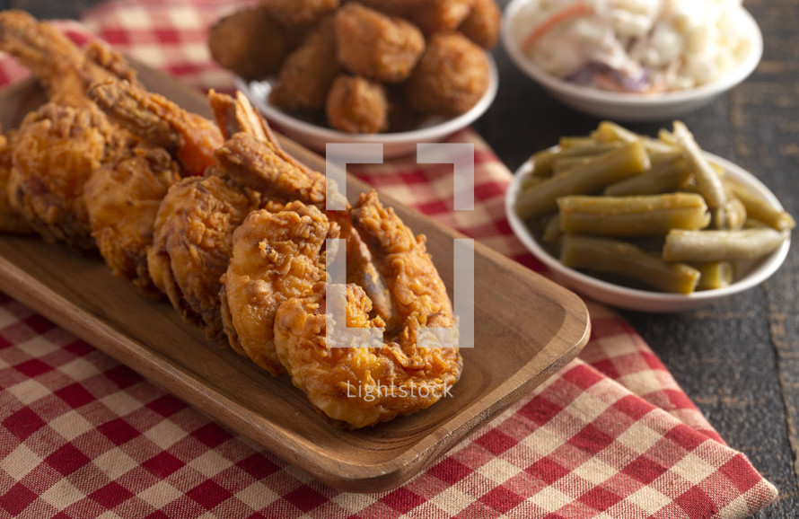 Fried Jumbo Shrimp with Tails on a Rustic Wooden Table