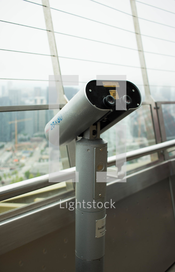 viewfinder telescope from the balcony of a skyscraper 