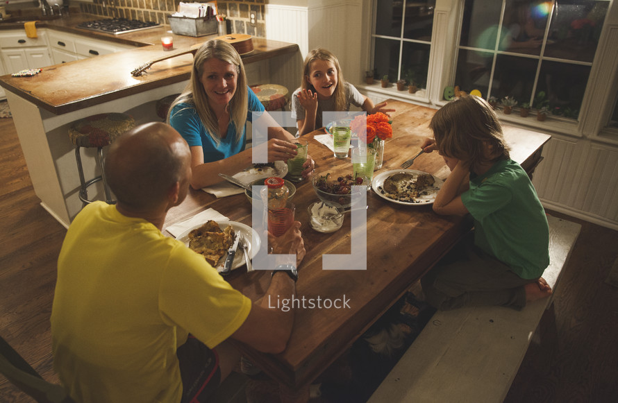 A family having dinner together. 