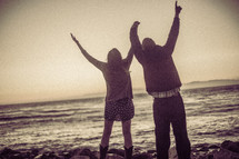 couple with raised hands - worship to God