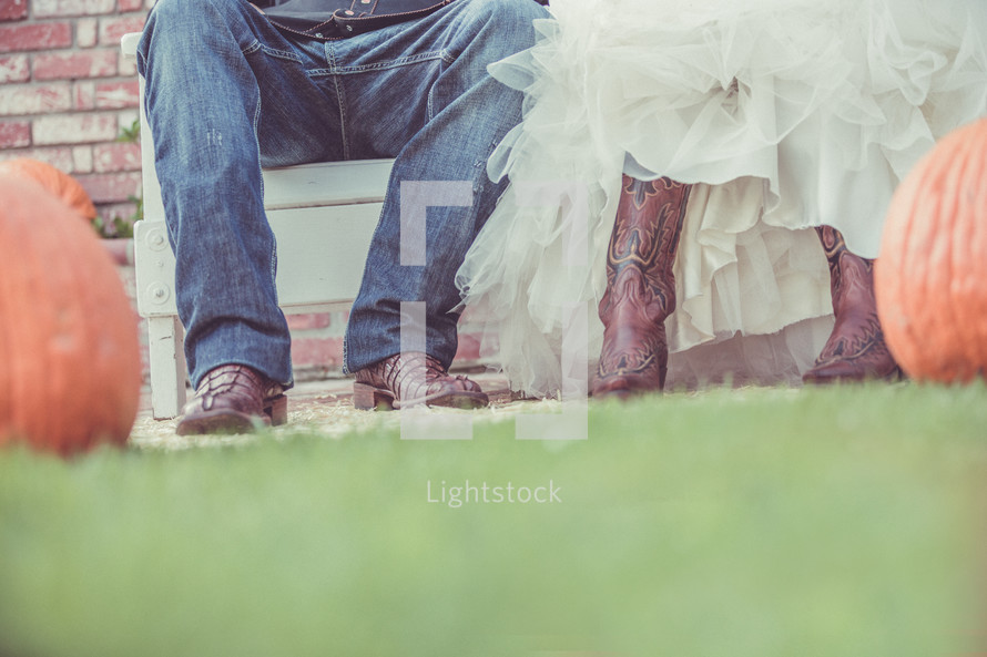 bride and groom in cowboy boots