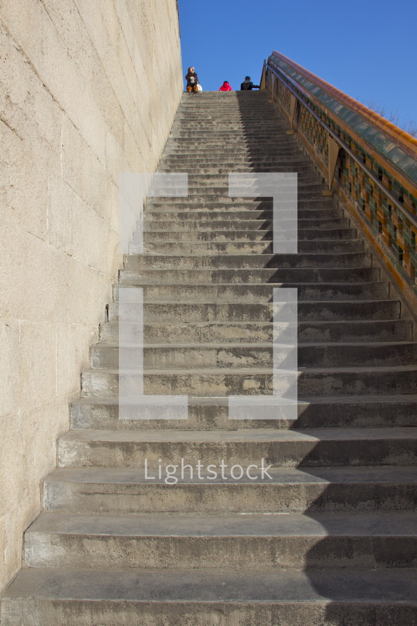 Long and steep flight of stone steps.