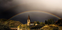 double rainbow over a chapel