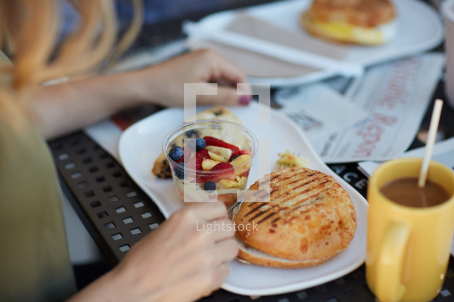 a woman eating breakfast 