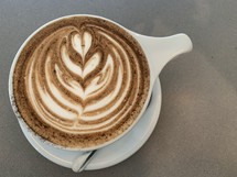 design in creamer in a coffee cup 