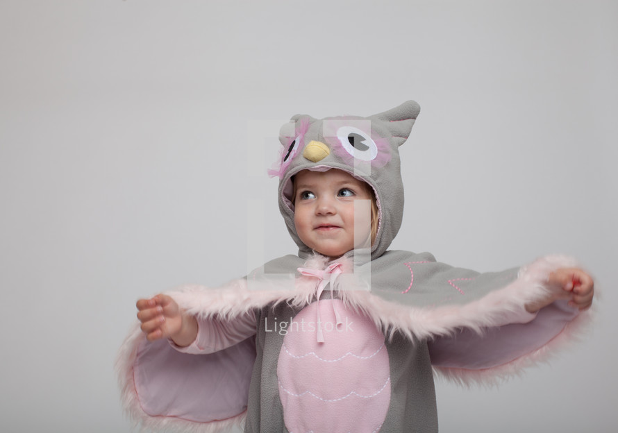 a toddler girl in a Halloween costume 