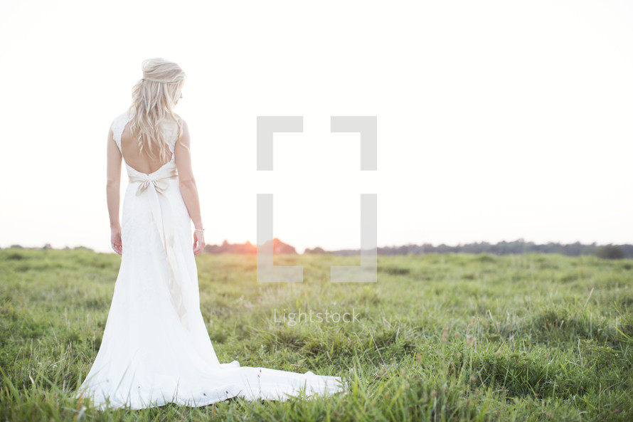 portrait of a bride standing outdoors 