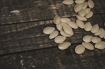pumpkin seeds on wood 