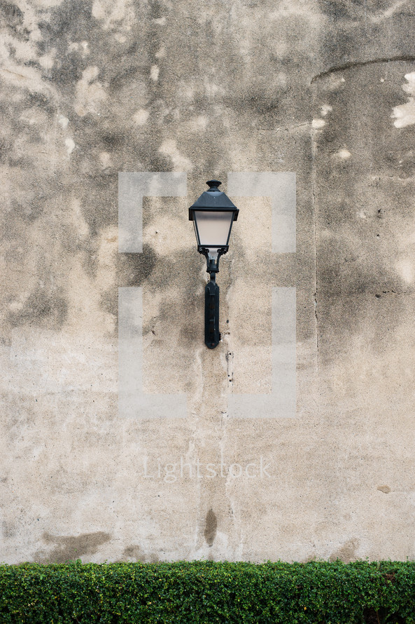 lamp on a concrete wall 