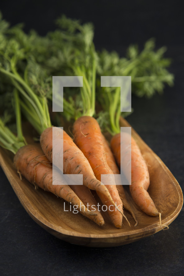 carrots in a wood bowl 