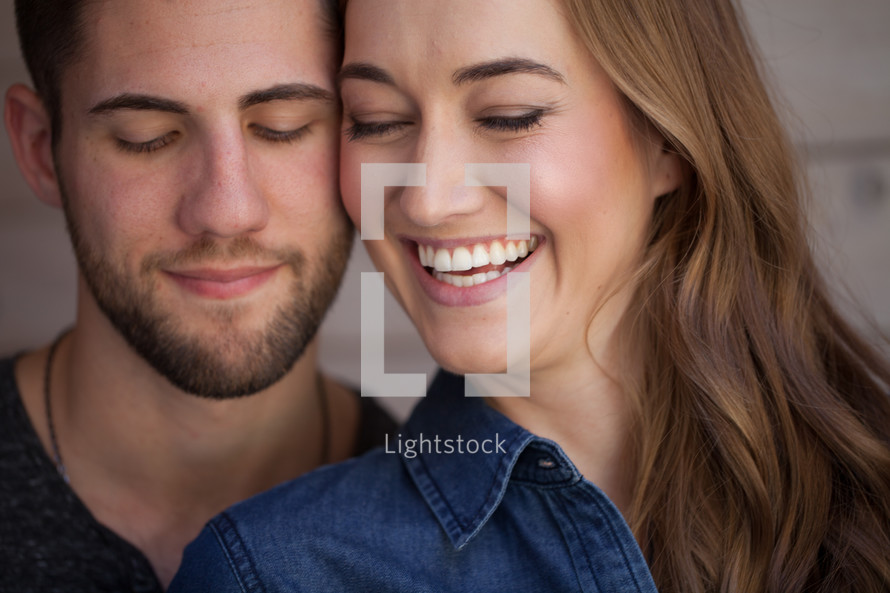 head shots of a happy couple 